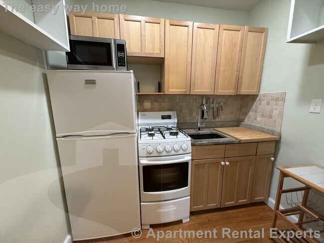 Building Photo - 50 Follen St Unit #110
