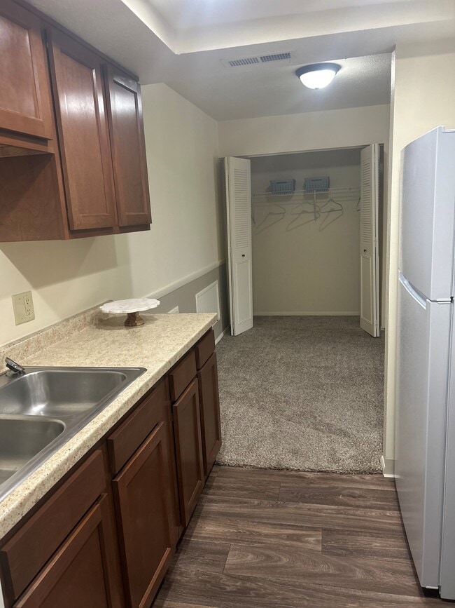 The Pinnacle - Kitchen with living room closet view