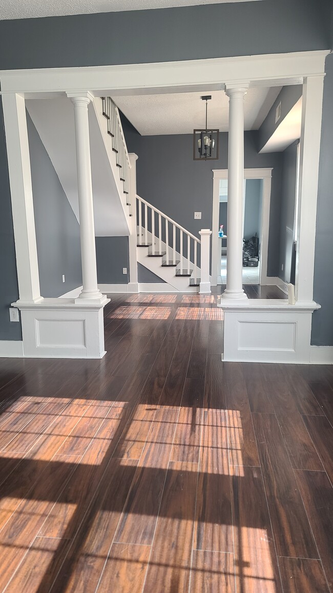 Living room and dining room - 2614 N Galvez St Townhome
