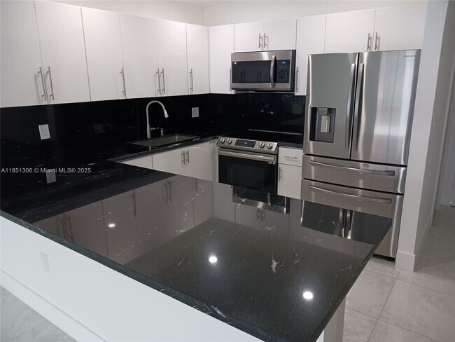 Building Photo - 6070 W 19th Ave Unit 316 Rental