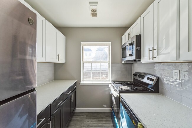 Elevate your culinary adventures in the modern kitchen of Parkside Apartments, featuring sleek appliances and abundant natural light. It's designed for both function and style. Explore your new living space today and schedule a tour!