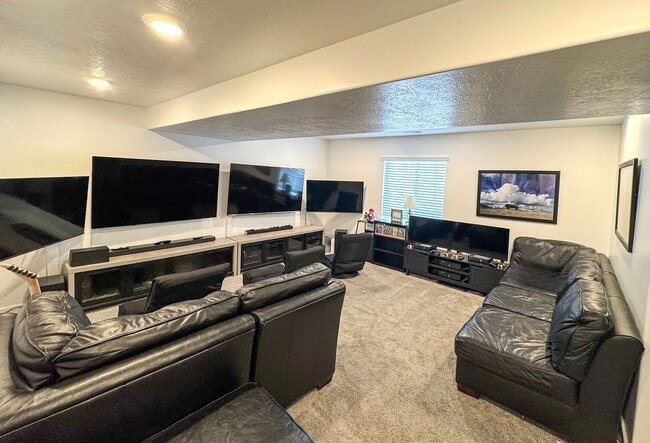 Photo - Beautiful 4 Bed 3.5 Bath Home in Syracuse + Bonus Room + Fenced Yard + 86” TV Included