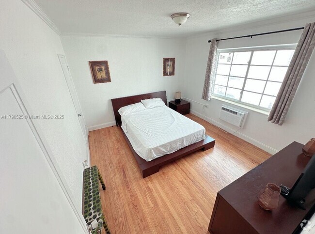 Building Photo - 7445 Harding Ave Unit 213 Rental