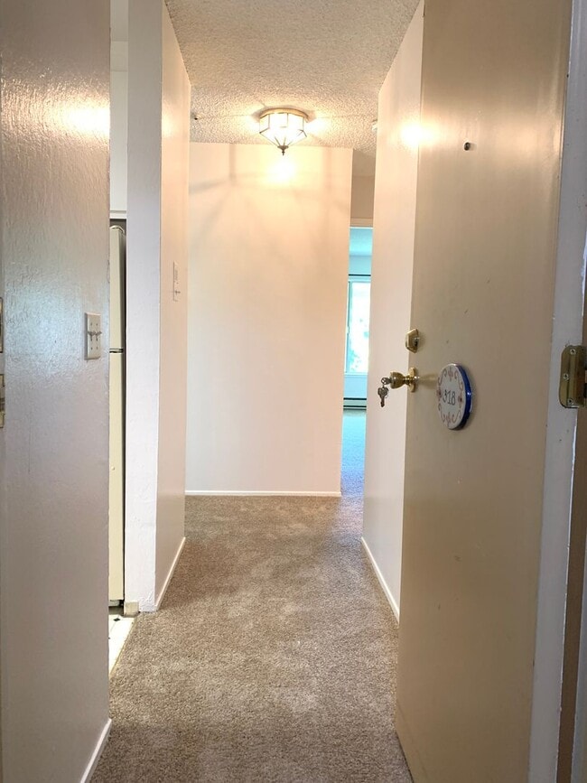 Photo - Top Floor Unit - Balcony - Elevator Access - Community Pool & Tennis Court Unit 318