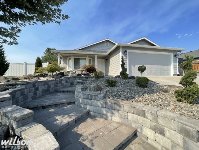 Photo - 3 Bed, 2 Bath Home with a Two-Car Garage, Fenced Backyard, and Lawn Care Included