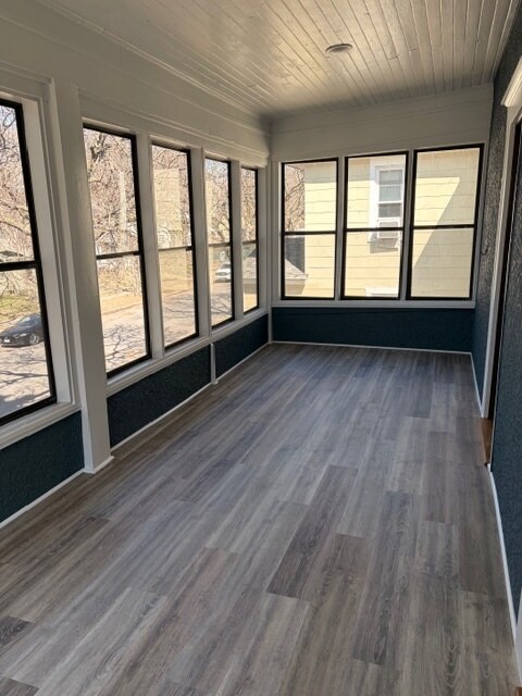This fabulous three-season porch spans the entire width of the house. - 623 Pierce St NE Unit Upper