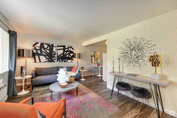 Living Room with Hardwood Inspired Floors - Olympus Park Apartments