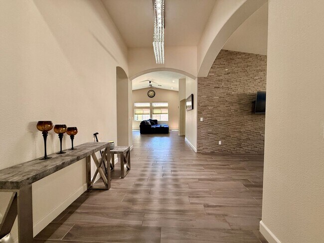 Photo - Welcome to this stunning 5-bedroom, 3-bath home located in the desirable Estates of Wigwam Ranch ...