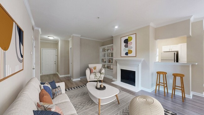 Cozy living room with fireplace and built-in bookcase - Reflections on Sweetwater Apartments