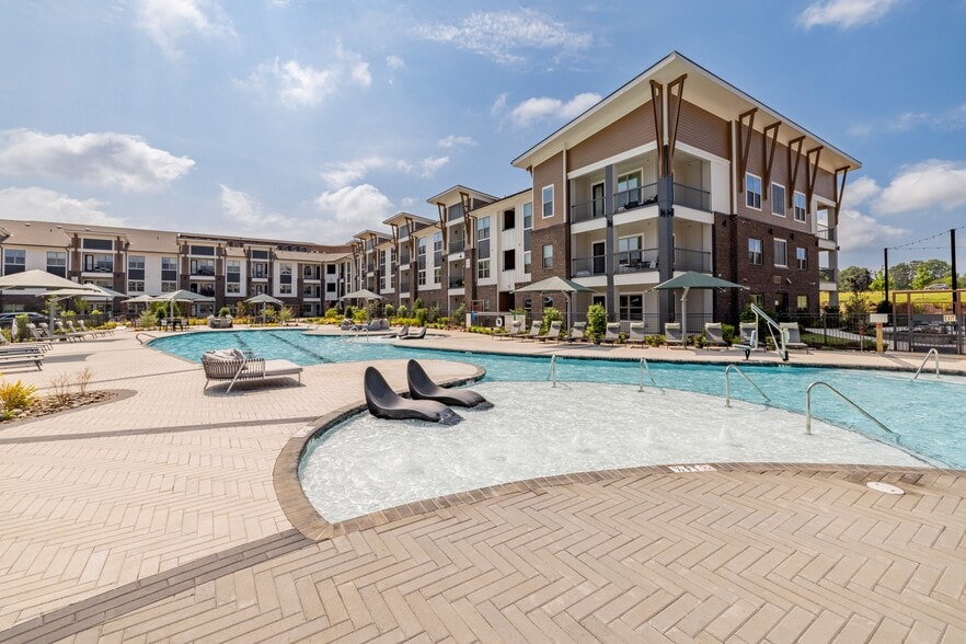 Salt-Water Pool - Resort-style pool with sun shelf, cabanas and grills for relaxing and entertaining close to home.