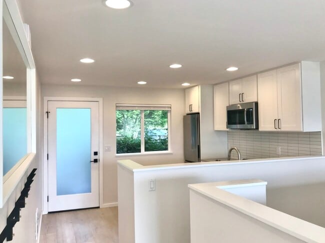 Enter into the kitchen - 4253 Palatine Ave N