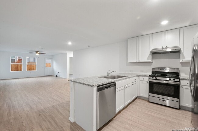 Photo - This beautiful single-story home has 4 bedrooms, 2 baths, vinyl flooring throughout, an open floo...