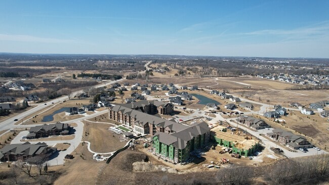 Birds-eye view of the Highlands of Aero Park and surrounding residential neighborhood. - Highlands at Aero Park Apartments & Townho...