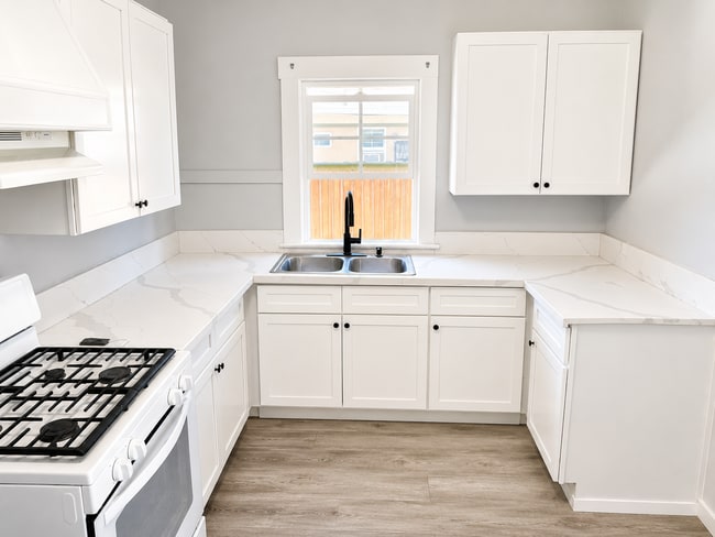 Photo - Private yard and parking, spacious updated interior. Don't miss out.