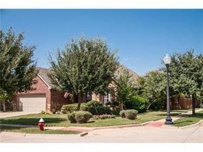 Former model home on corner lot is ready for move in!