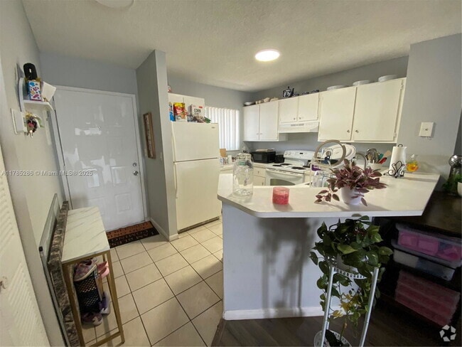 Building Photo - 8710 N Sherman Cir Unit 202 Rental