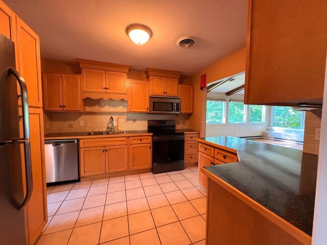 Photo - 5 Bedroom || 2 Bathroom - Single Family Home with Finished Basement Apartment