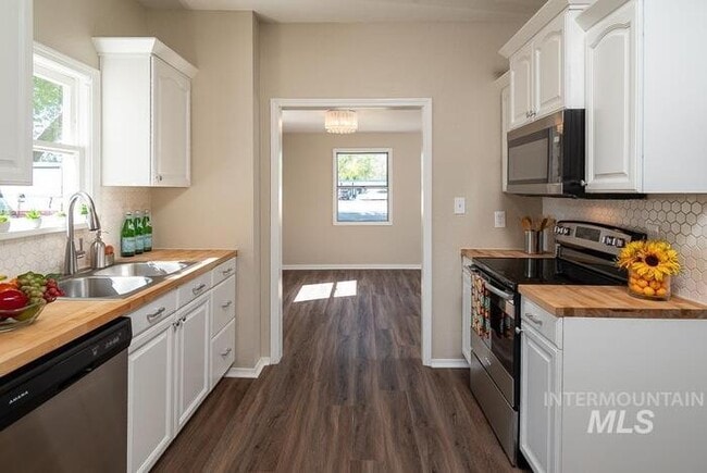 Photo - Charming 2 Bed, 1 Bath Single-Family Home with Large Backyard & RV Hookups!