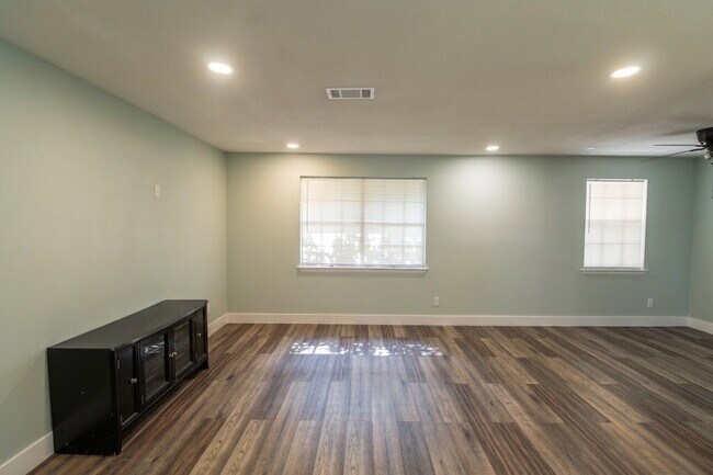 Photo - Updated West Pensacola 3BR Home with Luxury Plank Flooring, Modern Kitchen, 1-Car Garage & Large ...