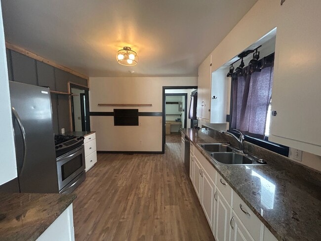 Photo - Bigfork Rodeo Farmhouse~ Fenced garden, greenhouse, garage, barn and shop!