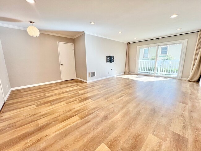 Photo - Contemporary 2 Bed Condo with 2 Garage Parking Spaces, Community Pool, and 3 Private Balconies