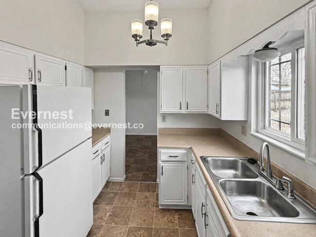 Photo - 5 Bed, 2.5 Bath Home with Fenced Yard & Garage / Available Soon!