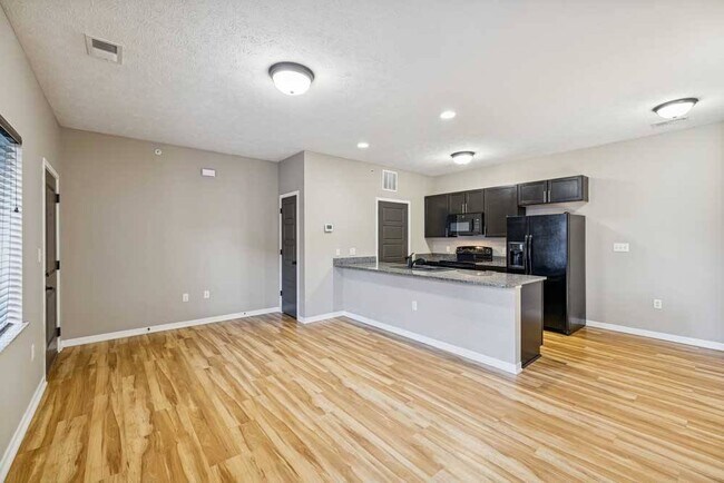 Modern finishes meet functional design in this open-concept kitchen and living space.