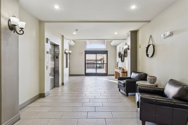 Welcoming lobby with elevator to the parking garage - 14000 N 94th St Unit 1089