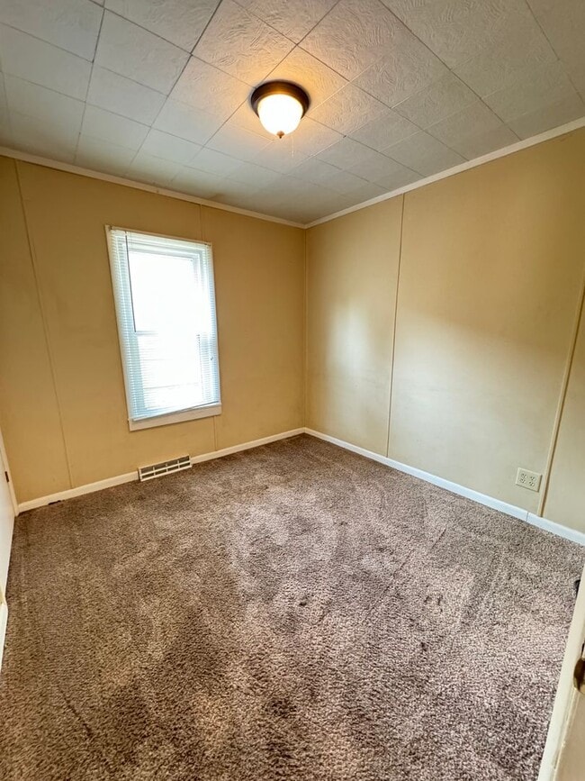 Photo - Charming 3-Bedroom, 1-Bathroom Home with Garage – $1,350/Month | Accepting Section 8