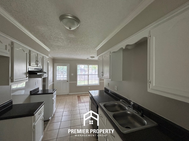 Photo - Spacious 4BR/2BA Near Southwind | High Ceilings, Brick Fireplace & 2-Car Garage