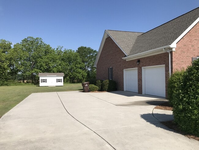 Photo - 4 bd 2 bth all brick w/ 2 car garage located on a 1 acre lot - lawn care, water, trash, washer/dr...