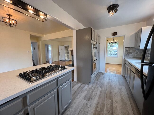Kitchen looking to dinning and mainroom - 8047 Campion Dr