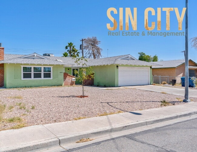 Building Photo - "Charming 4-Bedroom Retreat in Las Vegas –... Rental