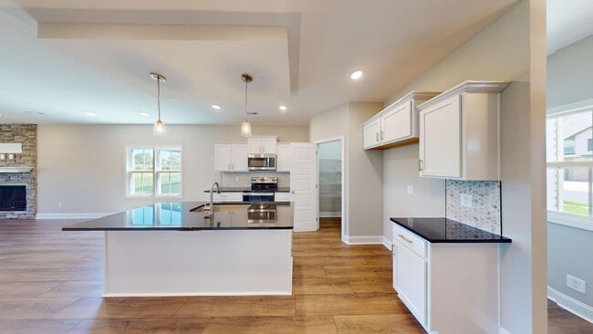 Photo - Contemporary Ranch Home with Open-Concept Design, Large Eat-In Kitchen and Covered Patio