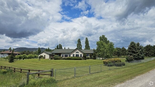 Building Photo - Out of town house with double garage and l...