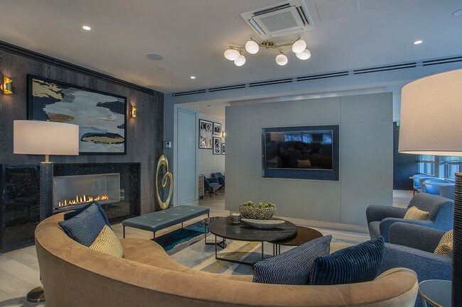Cozy Seating and a Wide Screen TV in the Club Lounge