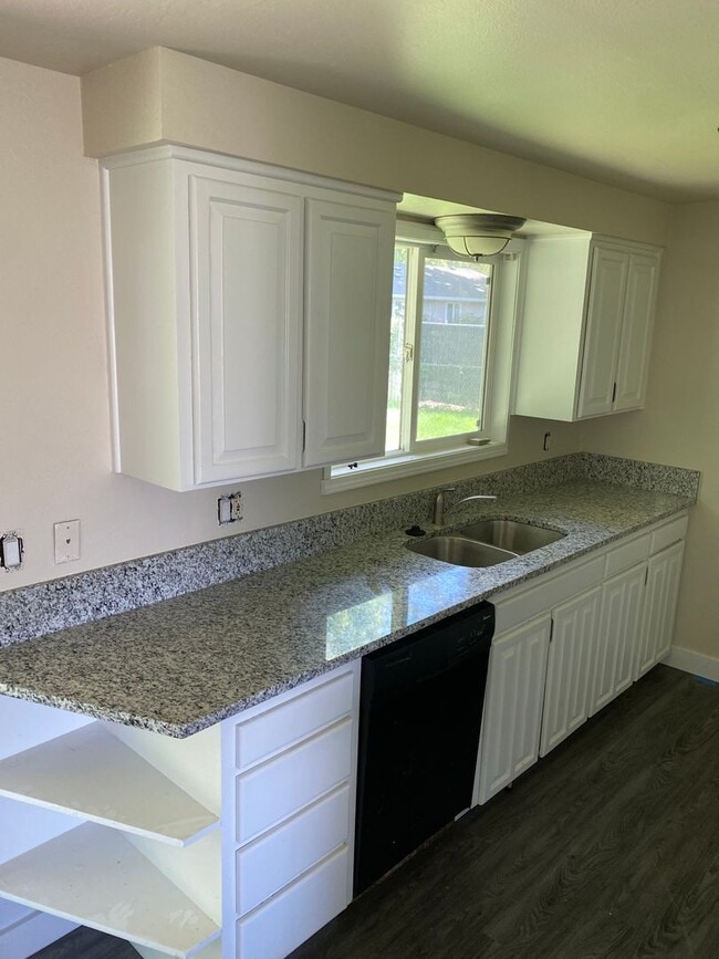 Photo - 4 Bedroom, 2 Bathroom House with Large Fenced Backyard, New Vinyl Plank Flooring, Granite Counter...