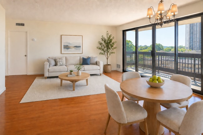 Living/dining area virtually staged to show layout options. Unit is leased unfurnished. - 5505 Seminary Rd Unit 607