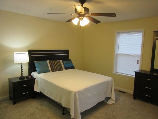 Photo - Settle in and cozy up in this comfortable lower-level two-bedroom apartment.