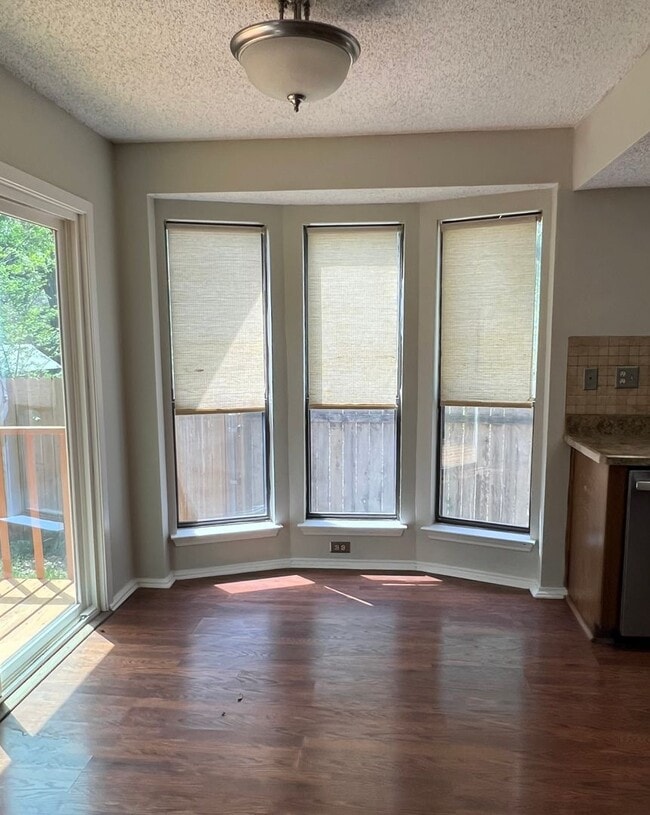 Photo - Corner Lot with Large Deck and Cozy Backyard