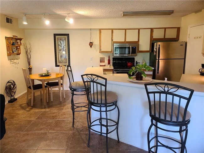 Building Photo - 9999 Summerbreeze Dr Unit 417