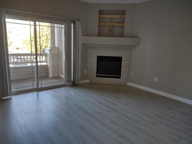 living room w/deck and fireplace - 8318 S Independence Cir Unit 203