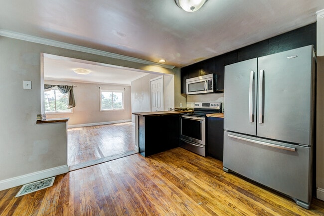 Photo - AVAILABLE AUGUST 2026 - Beautiful 3 Bedroom Home w/ OFF-STREET PARKING & Deck!