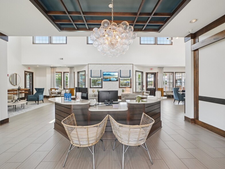 Modern resident clubhouse and leasing lounge at Village at Broadstone Station apartments in Apex, NC