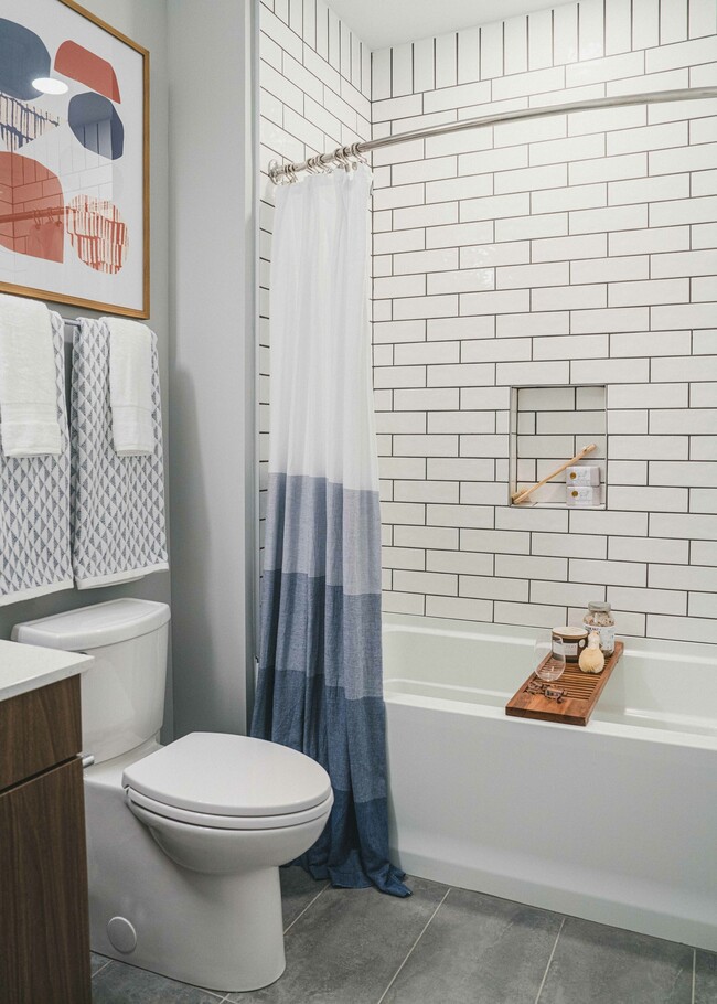 Escape to tranquility in our apartments with a luxurious bathroom, featuring a relaxing tub.