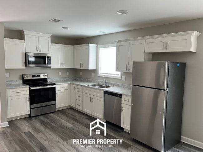 Photo - Spacious 4BR/2BA in Tuscaloosa | Hardwood Floors, 2-Car Garage & Covered Back Patio