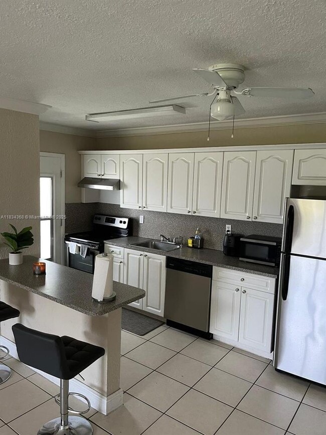 Building Photo - 898 NW 45th Ave Unit 42-42 Rental