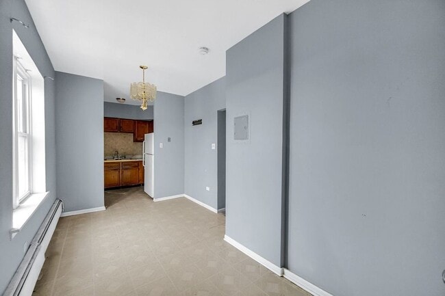 Building Photo - 7017 S Merrill Ave Unit 305