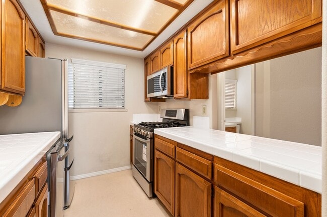 Photo - 2 Bedroom 1.5 Bath Townhome with pvt patio (AC/Pool/Gated Parking/EV Chargers) Unit 7012 Casa Lane #14