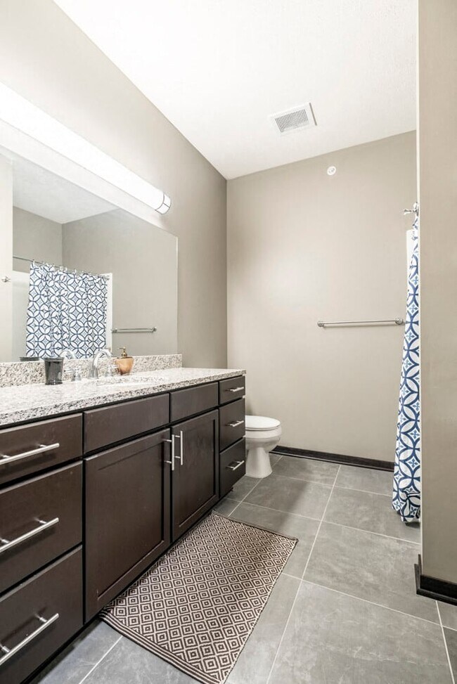 Enjoy granite countertops and tile flooring in the bathrooms.